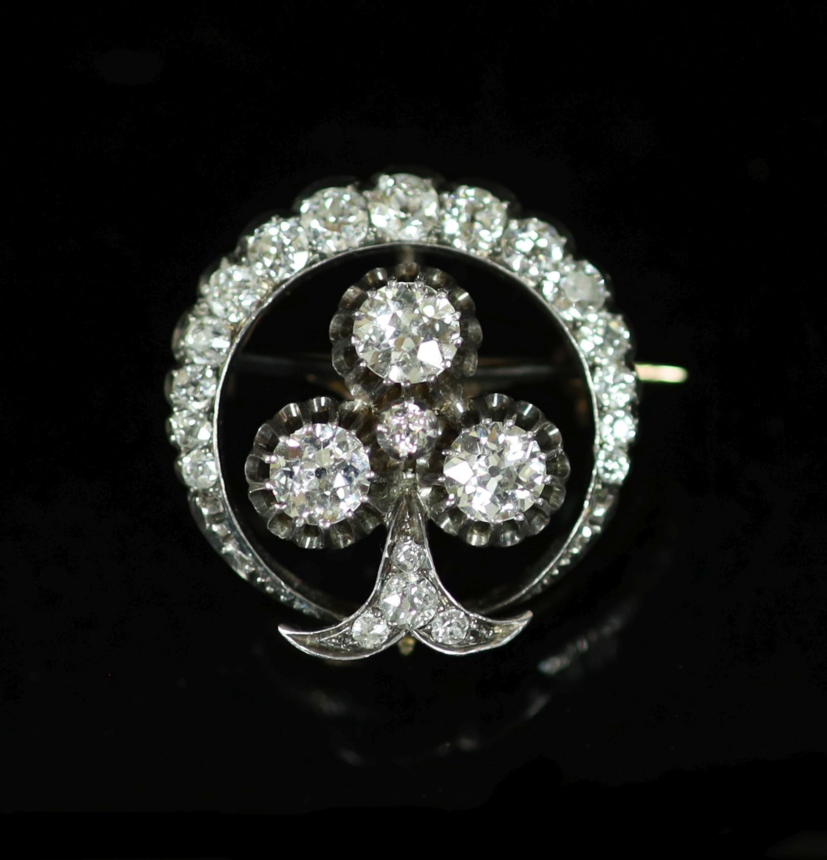 A late Victorian gold, silver and diamond cluster set 'crescent and clover' circular brooch